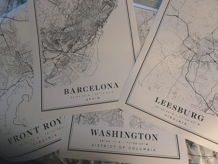 Framed city map prints of Front Royal, VA, Leesburg, VA, Washington, DC, and Barcelona.