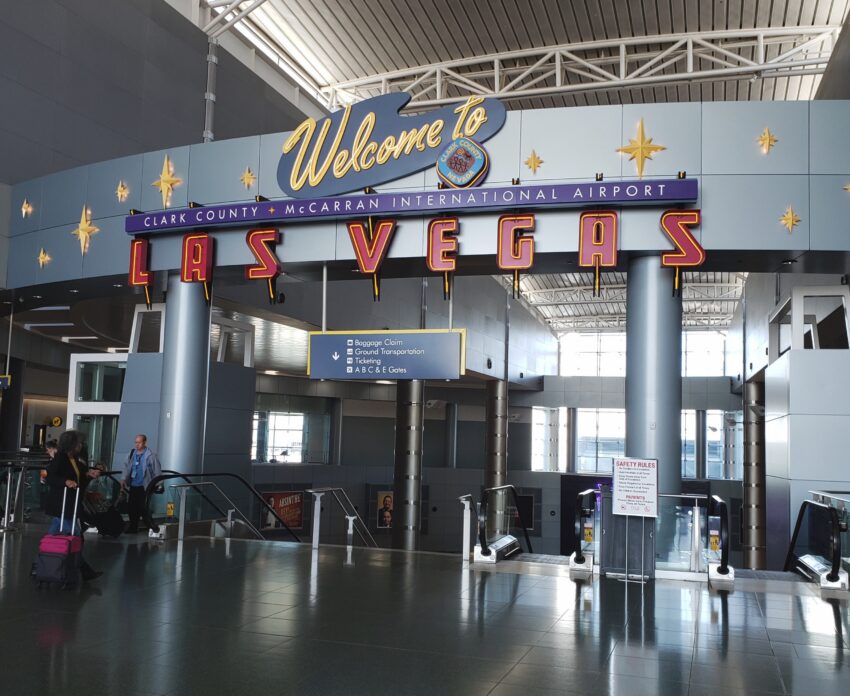 Welcome to Las Vegas” sign at McCarran International Airport entrance, bright and iconic